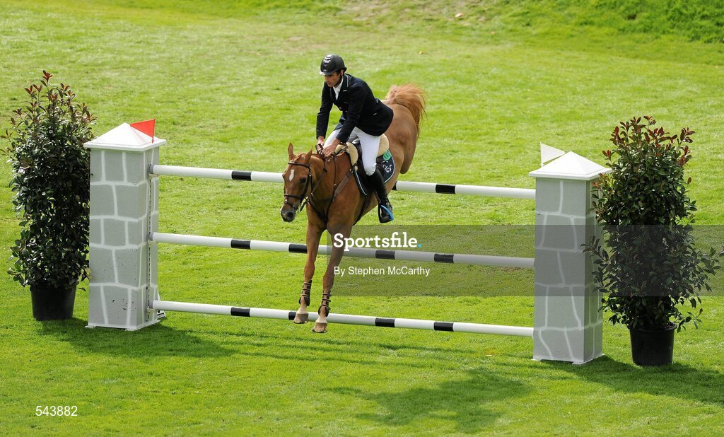 4 August 2011; Denis Lynch, Ireland, competing on Night Train, during the Power & Speed Event. Dublin Horse Show 2011, RDS, Ballsbridge, Dublin. Picture credit: Stephen McCarthy / SPORTSFILE
