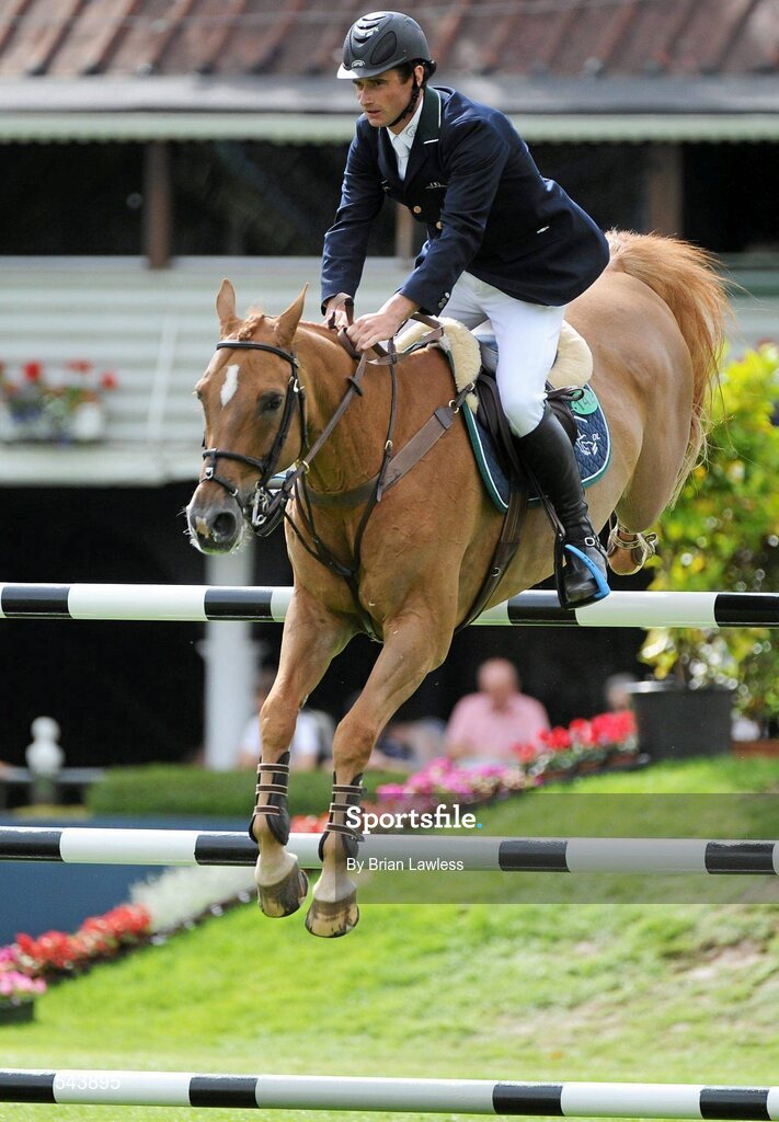4 August 2011; Denis Lynch, Ireland, competing on Night Train, during the Power & Speed Event. Dublin Horse Show 2011, RDS, Ballsbridge, Dublin. Picture credit: Brian Lawless / SPORTSFILE