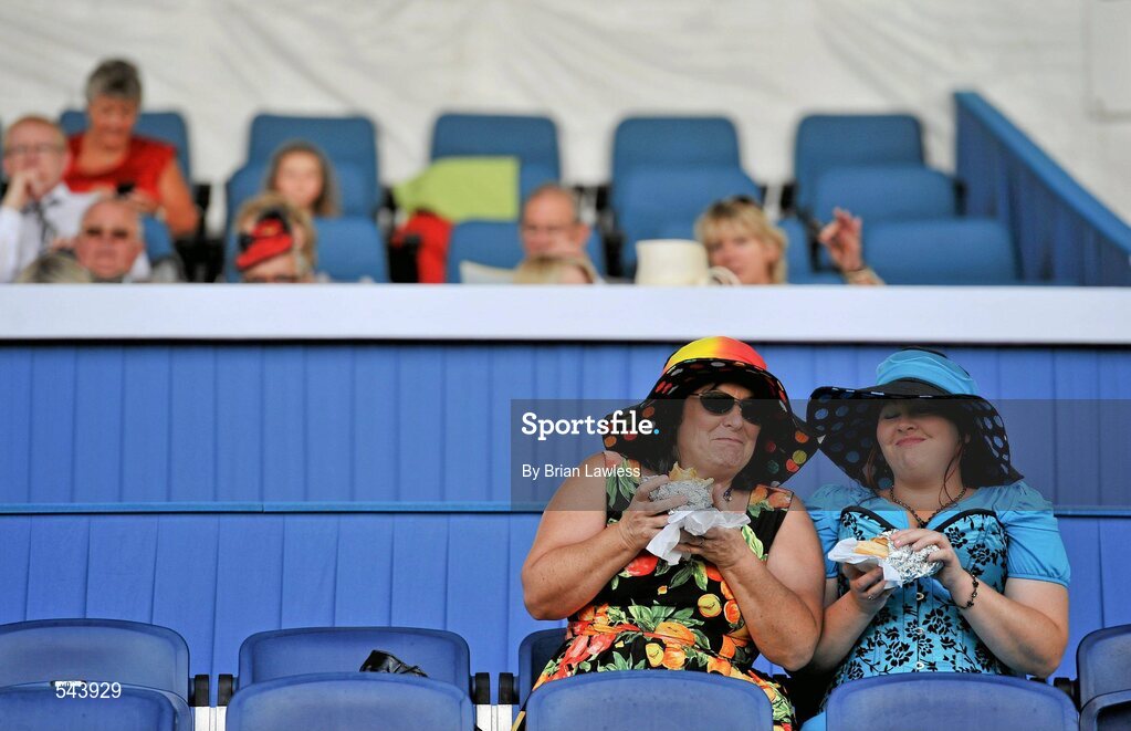 4 August 2011; Two ladies enjoy a bite to eat between events. Dublin Horse Show 2011, RDS, Ballsbridge, Dublin. Picture credit: Brian Lawless / SPORTSFILE