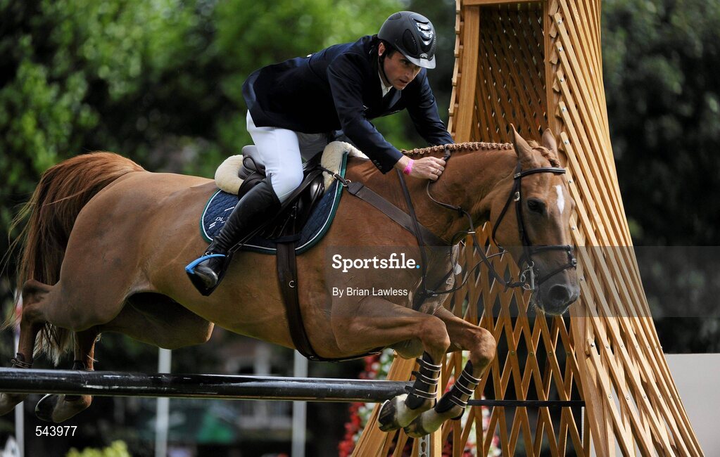 4 August 2011; Denis Lynch, Ireland, competing on Night Train, during the Power & Speed Event. Dublin Horse Show 2011, RDS, Ballsbridge, Dublin. Picture credit: Brian Lawless / SPORTSFILE