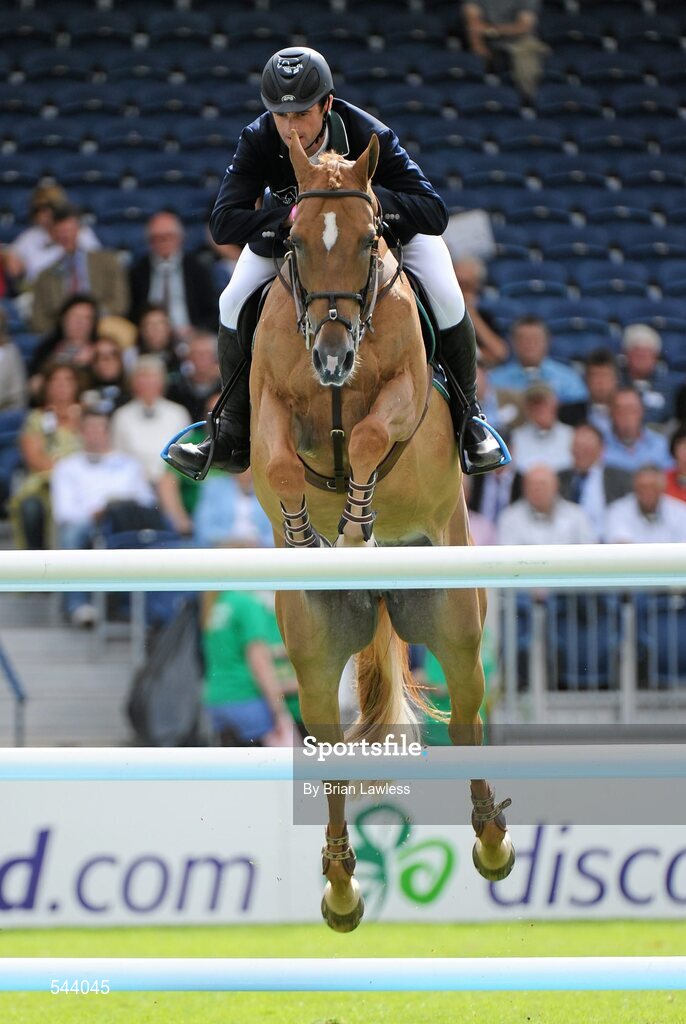 4 August 2011; Denis Lynch, Ireland, competing on Night Train, during the Power & Speed Event. Dublin Horse Show 2011, RDS, Ballsbridge, Dublin. Picture credit: Brian Lawless / SPORTSFILE