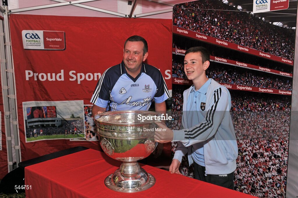 6 August 2011; Dublin supporters Richard Gregan with his son Brian, pictured with the Sam Maguire before the GAA Football All-Ireland Senior Championship Quarter-Final, Dublin v Tyrone, Croke Park, Dublin. Picture credit: David Maher / SPORTSFILE