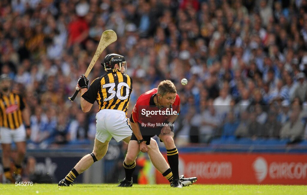 7 August 2011; Referee Barry Kelly ducks as Michael Rice takes a shot for Kilkenny. GAA Hurling All-Ireland Senior Championship Semi-Final, Kilkenny v Waterford, Croke Park, Dublin. Picture credit: Ray McManus / SPORTSFILE