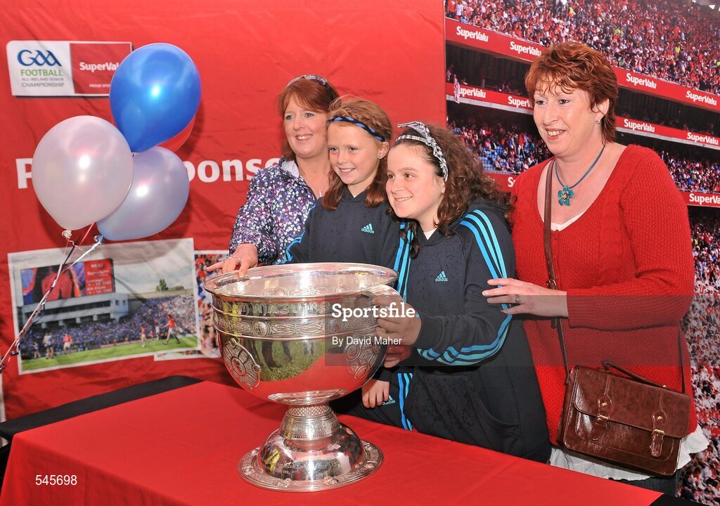 6 August 2011; Patrons have their picture taken with the Sam Maguire cup in the Fanzone ahead of the GAA Football All-Ireland Senior Championship Quarter-Final, Dublin v Tyrone, Croke Park, Dublin. Picture credit: David Maher / SPORTSFILE