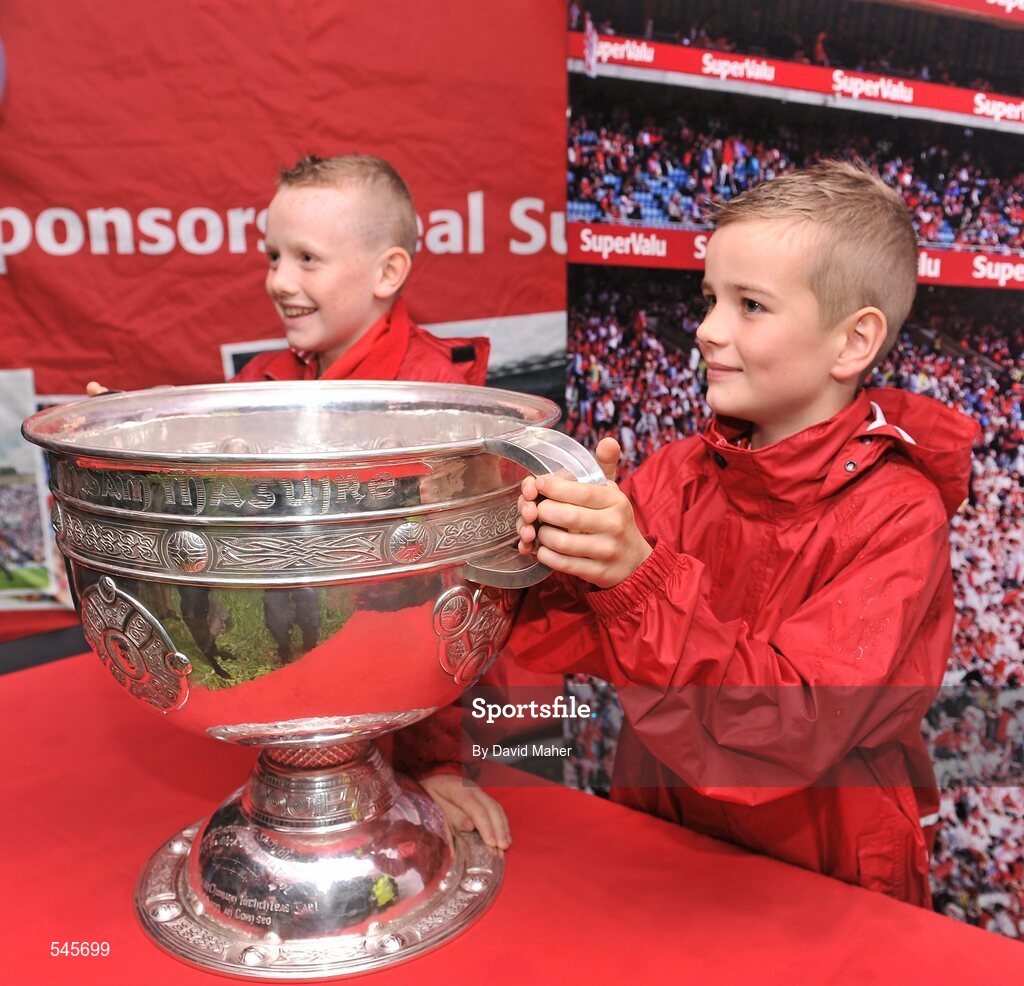 6 August 2011; Patrons have their picture taken with the Sam Maguire cup in the Fanzone ahead of the GAA Football All-Ireland Senior Championship Quarter-Final, Dublin v Tyrone, Croke Park, Dublin. Picture credit: David Maher / SPORTSFILE