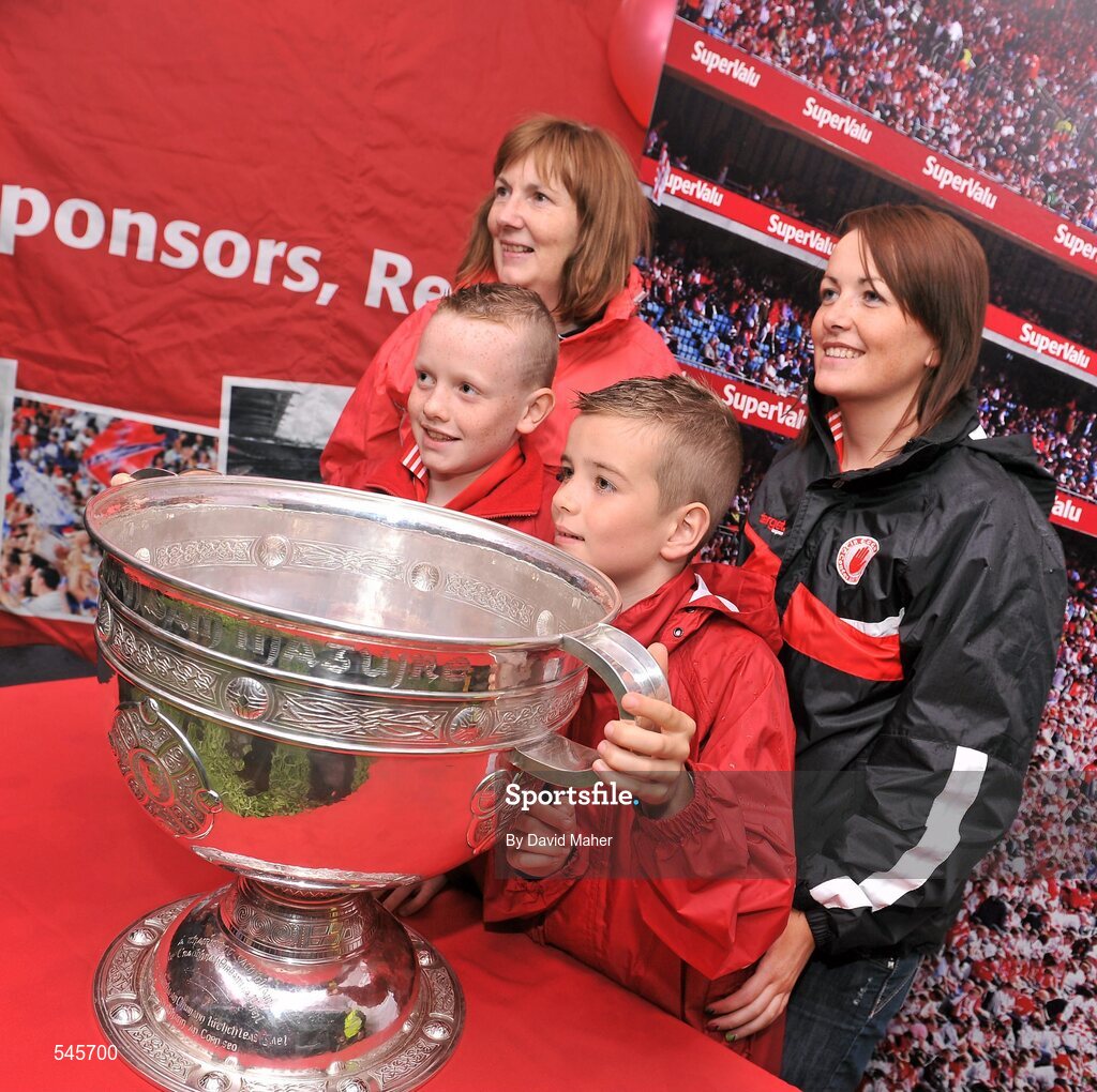 6 August 2011; Patrons have their picture taken with the Sam Maguire cup in the Fanzone ahead of the GAA Football All-Ireland Senior Championship Quarter-Final, Dublin v Tyrone, Croke Park, Dublin. Picture credit: David Maher / SPORTSFILE