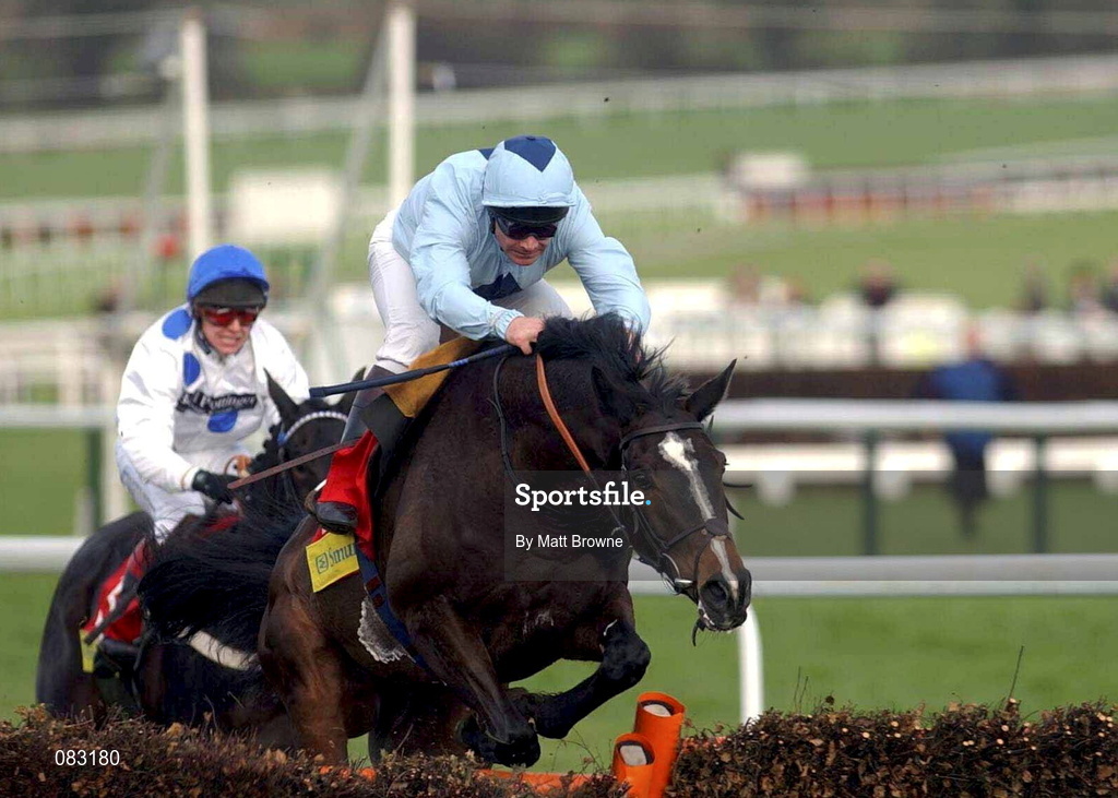 12 March 2002; Hors La Lo III with Dean Gallagher up jumps the last to win the Smurfit Champion Hurdle Challenge Trophy during Day One of the Cheltenham Racing Festival at Prestbury Park in Cheltenham, England. Photo by Matt Browne/Sportsfile