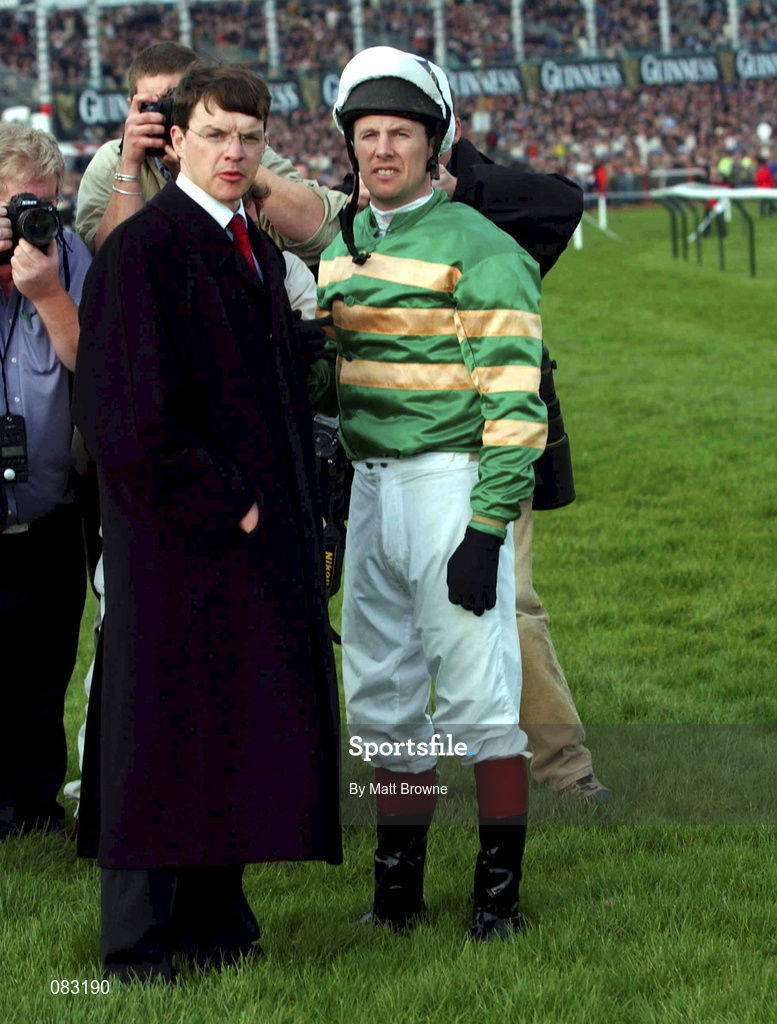 12 March 2002; Istabraq with jockey Charlie Swan and trainer Aiden O'Brien after pulling up in The Smurfit Champion Hurdle Challenge Trophy during Day One of the Cheltenham Racing Festival at Prestbury Park in Cheltenham, England. Photo by Matt Browne/Sportsfile