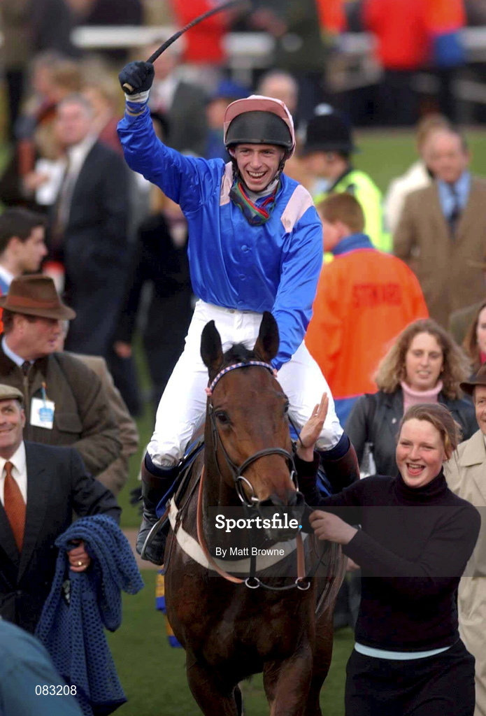 12 March 2002; David Crosse celebrates winning the Fulke Walwyn Kim Muir Challenge Cup Handicap Steeple Chase on The Bushkeeper during Day One of the Cheltenham Racing Festival at Prestbury Park in Cheltenham, England. Photo by Matt Browne/Sportsfile