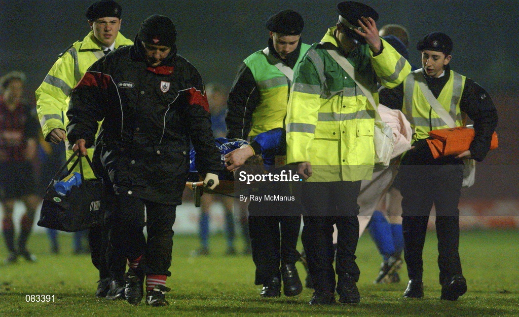15 March 2002; Keith O'Connor of Longford Town is carried off injured during the Eircom League Premier Division match between Bohemians and Longford Town at Dalymount Park in Dublin. Photo by Ray McManus/Sportsfile