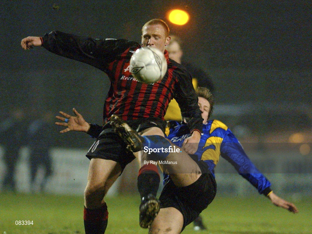 15 March 2002; Glen Crowe of Bohemians is tackled by  Wesley Byrne of Longford Town during the Eircom League Premier Division match between Bohemians and Longford Town at Dalymount Park in Dublin. Photo by Ray McManus/Sportsfile