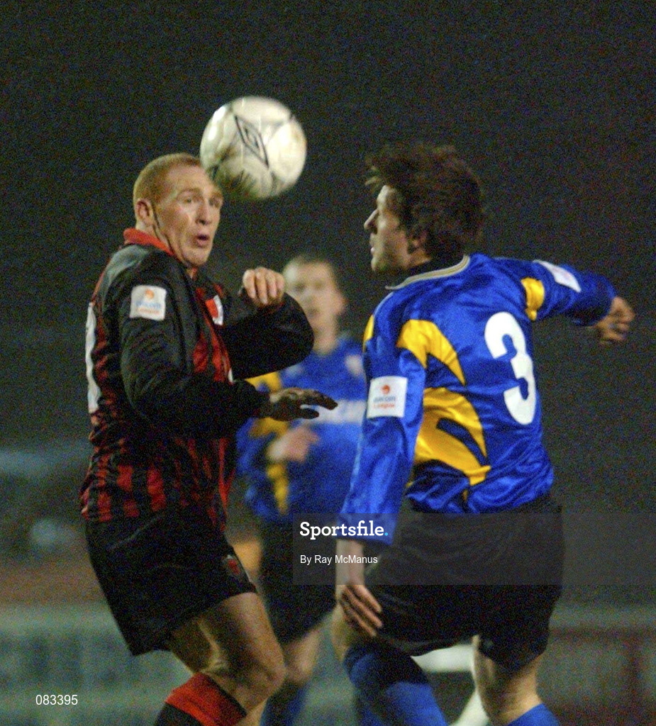 15 March 2002; Glen Crowe of Bohemians is tackled by  Wesley Byrne of Longford Town during the Eircom League Premier Division match between Bohemians and Longford Town at Dalymount Park in Dublin. Photo by Ray McManus/Sportsfile