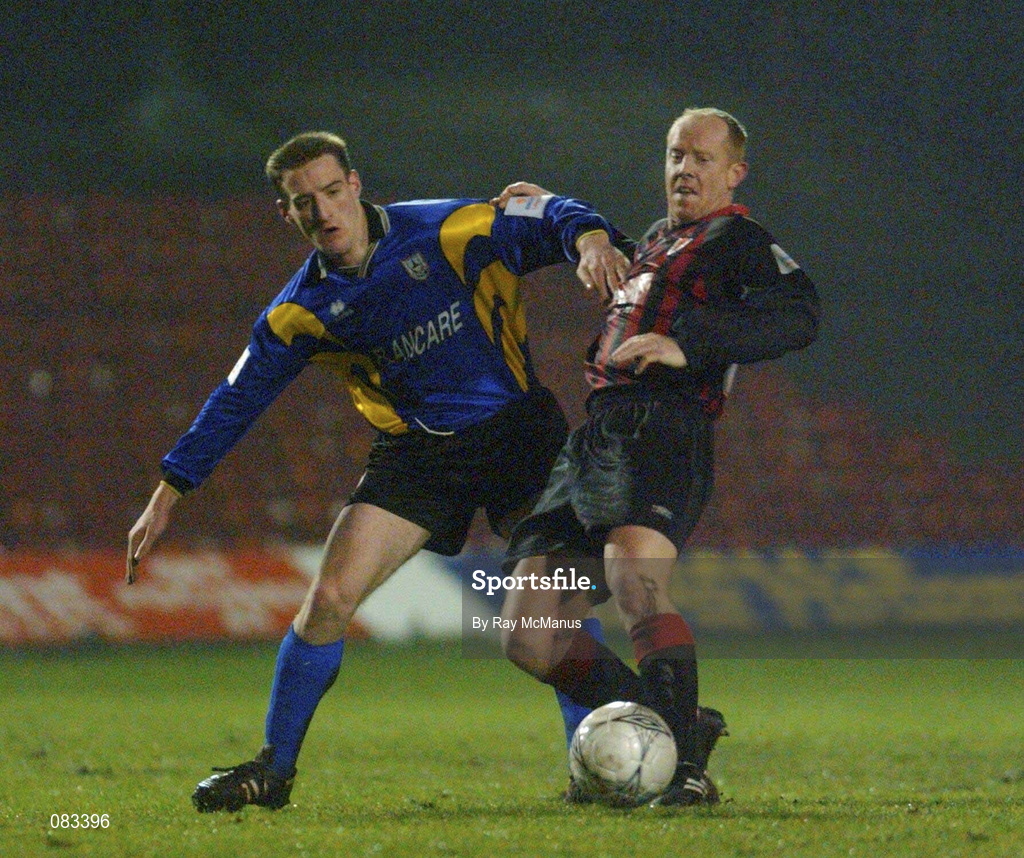 15 March 2002; Dave Hill of Bohemians in action against Fergal Coleman of Longford Town during the Eircom League Premier Division match between Bohemians and Longford Town at Dalymount Park in Dublin. Photo by Ray McManus/Sportsfile