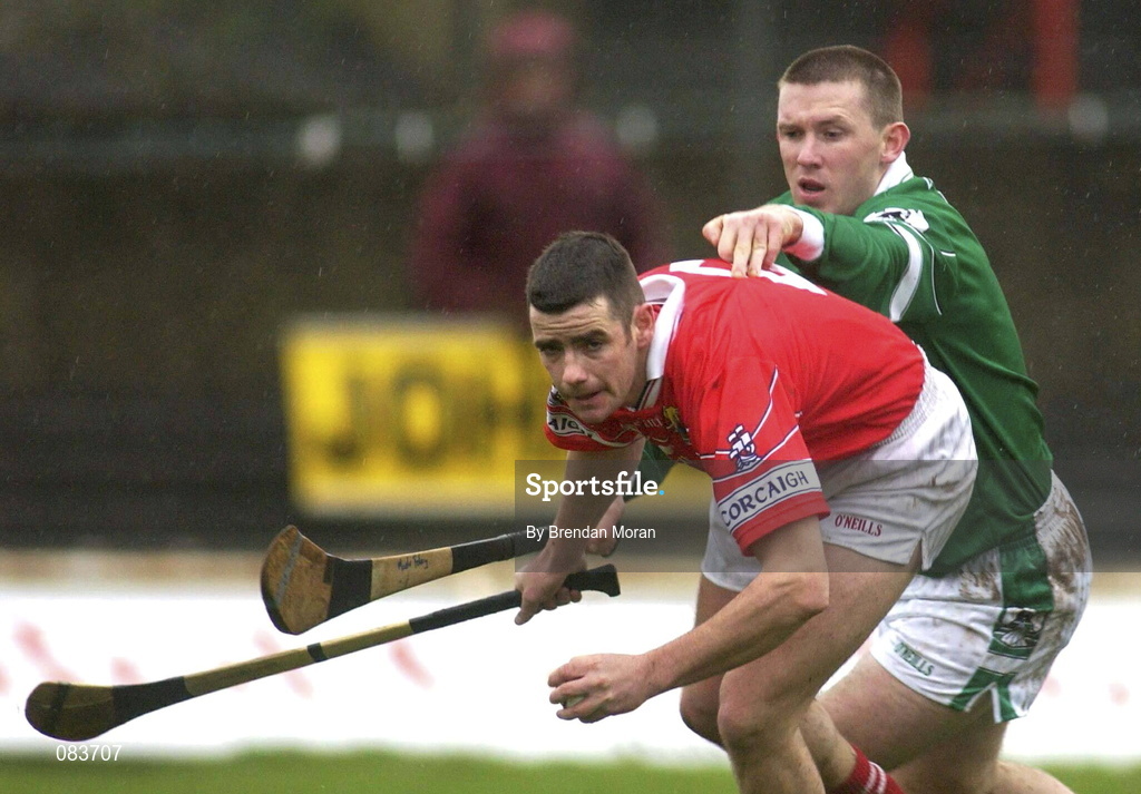 25 February 2002; Mark Prendergast of Cork in action against Mark Foley of Limerick during the Allianz National Hurling League Division 1B Round 1 match between Limerick and Cork at the Gaelic Grounds in Limerick. Photo by Brendan Moran/Sportsfile