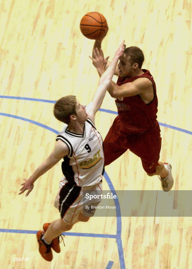 24 March 2002; Barnaby Craddock of Frosties Tralee shoots for two despite the attentions of Jonathan Grennell of Killester during the ESB Men's National Championships Final between Frosties Tigers Tralee and Dart Killester at the National Exhibition Centre in Killarney, Kerry. Photo by Brendan Moran/Sportsfile