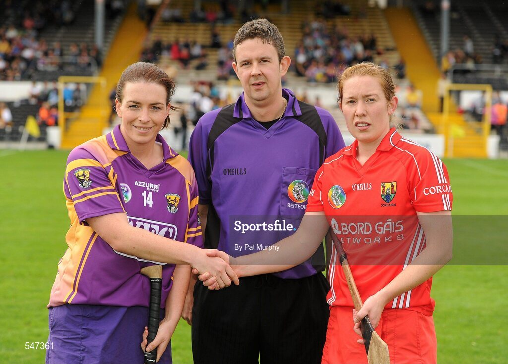 13 August 2011; Ursula Jacob, Wexford, and Rena Buckley, Cork, right, shake hands in front of referee Fintan McNamara. All-Ireland Senior Camogie Championship Semi-Final in association with RTE Sport, Cork v Wexford, Nowlan Park, Kilkenny. Picture credit: Pat Murphy / SPORTSFILE