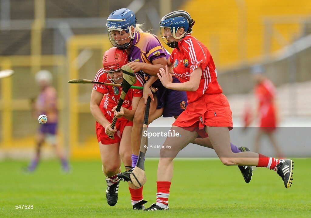13 August 2011; Katrina Parrock, Wexford, in action against Anna Geary, left, and Jenny Duffy, Cork. All-Ireland Senior Camogie Championship Semi-Final in association with RTE Sport, Cork v Wexford, Nowlan Park, Kilkenny. Picture credit: Pat Murphy / SPORTSFILE