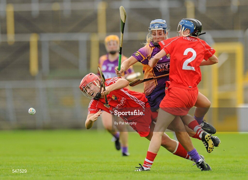 13 August 2011; Katrina Parrock, Wexford, in action against Anna Geary, left, and Jenny Duffy, Cork. All-Ireland Senior Camogie Championship Semi-Final in association with RTE Sport, Cork v Wexford, Nowlan Park, Kilkenny. Picture credit: Pat Murphy / SPORTSFILE
