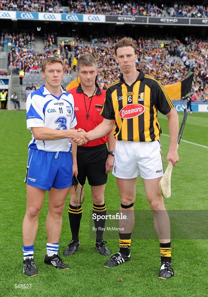 7 August 2011; Waterford captain Stephen Molumphy, left, and Kilkenny captain Brian Hogan shake hands in front of referee Barry Kelly. GAA Hurling All-Ireland Senior Championship Semi-Final, Kilkenny v Waterford, Croke Park, Dublin. Picture credit: Ray McManus / SPORTSFILE