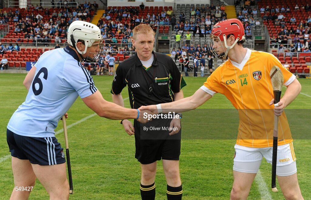 20 August 2011; Dublin captain Liam Rushe shakes hands with Antrim captain Conor McCann in the company of referee Fergus Smith. Bord Gais Energy GAA Hurling Under 21 All-Ireland Championship Semi-Final, Antrim v Dublin, Pairc Esler, Newry, Co. Down. Picture credit: Oliver McVeigh / SPORTSFILE