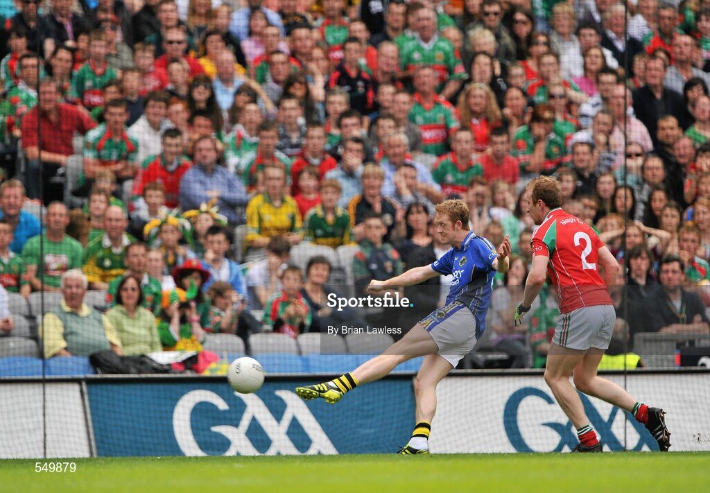 21 August 2011; Kerry's Colm Cooper shoots to score his side's only goal despite the attentions of Tom Cunniffe, Mayo. GAA Football All-Ireland Senior Championship Semi-Final, Mayo v Kerry, Croke Park, Dublin. Picture credit: Brian Lawless / SPORTSFILE