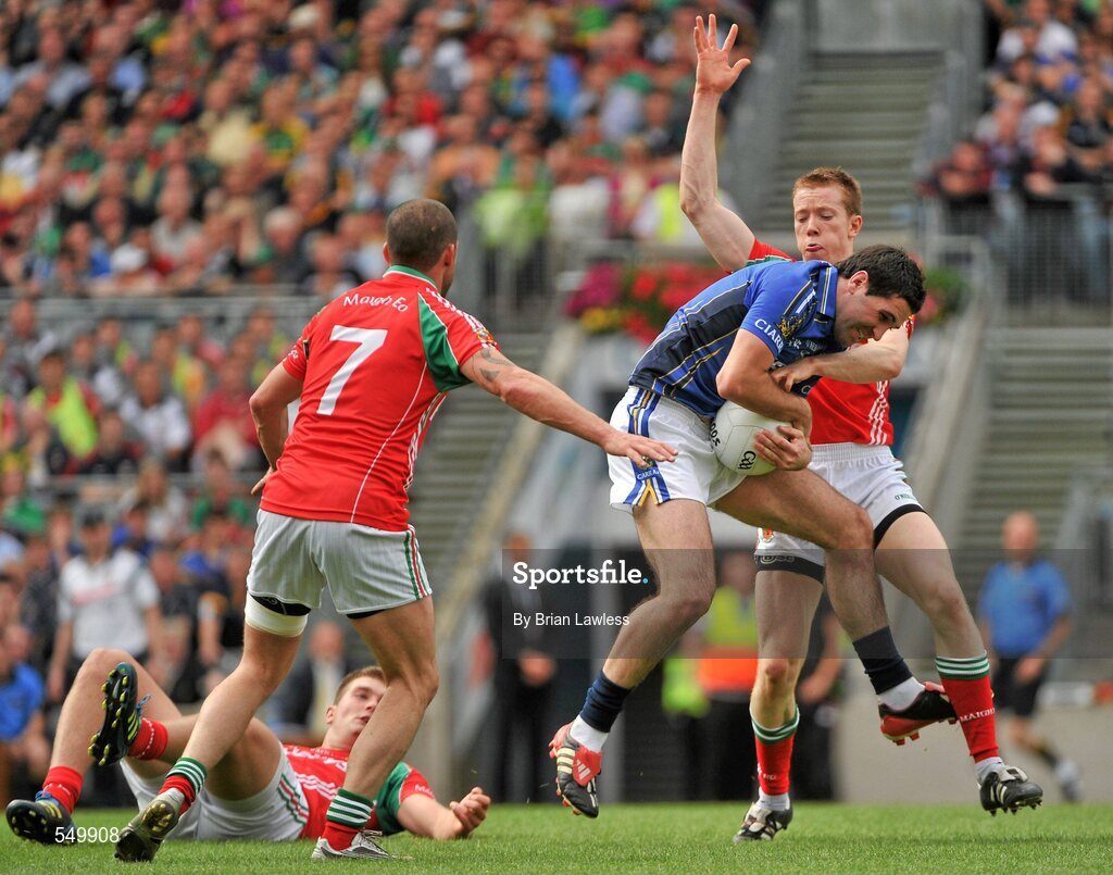 21 August 2011; Bryan Sheehan, Kerry, in action against Donal Vaughan, right, Trevor Mortimer, and Aidan O'Shea, on the ground, Mayo. GAA Football All-Ireland Senior Championship Semi-Final, Mayo v Kerry, Croke Park, Dublin. Picture credit: Brian Lawless / SPORTSFILE