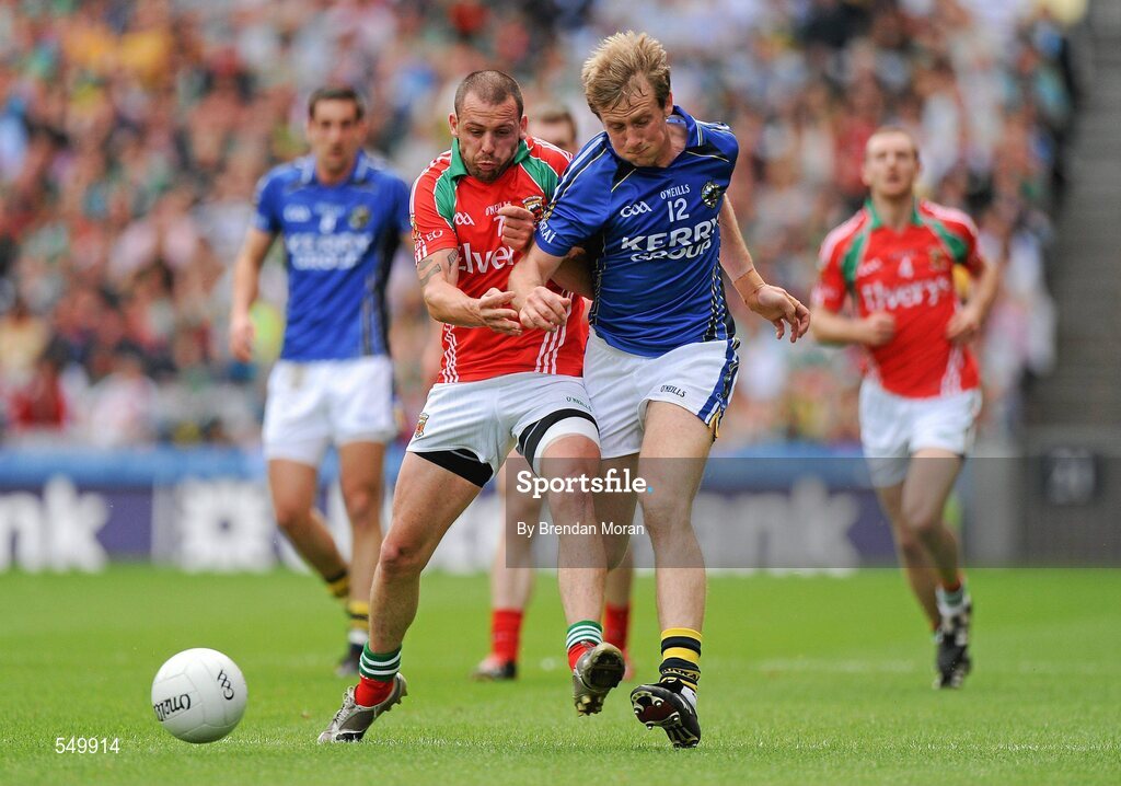 21 August 2011; Donnchadh Walsh, Kerry, is shouldered by Trevor Mortimer, Mayo. GAA Football All-Ireland Senior Championship Semi-Final, Mayo v Kerry, Croke Park, Dublin. Picture credit: Brendan Moran / SPORTSFILE