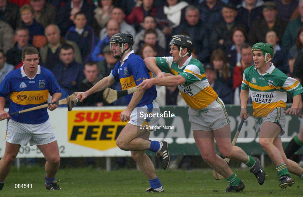 30 March 2002; Eoin Kelly of Tipperary in action against Hubert Rigney of Offaly during the Allianz National Hurling League Division 1B Round 1 match between Offaly and Tipperary in St Brendan's Park in Birr, Offaly. Photo by Brendan Moran/Sportsfile