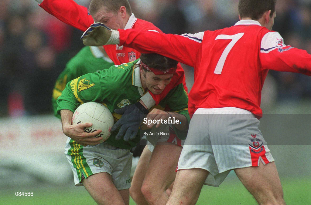 31 March 2002; Fionnan Kelliher of Kerry is tackled by Aaron Hoey and Peter McGinnity, 7, of Louth during the Allianz National Football League Division 2A Round 7 match between Louth and Kerry at Páirc Mhuire in Ardee in Louth. Photo by Aoife Rice/Sportsfile