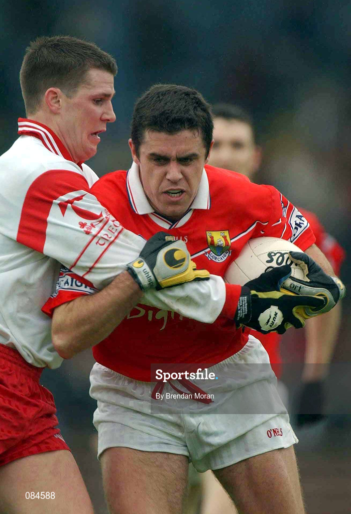 31 March 2002; Martin Cronin of Cork in action against Colin Holmes of Tyrone during the Allianz Football League Division 1A Round 7 match between Cork and Tyrone at Páirc Uí Chaoimh in Cork. Photo by Brendan Moran/Sportsfile
