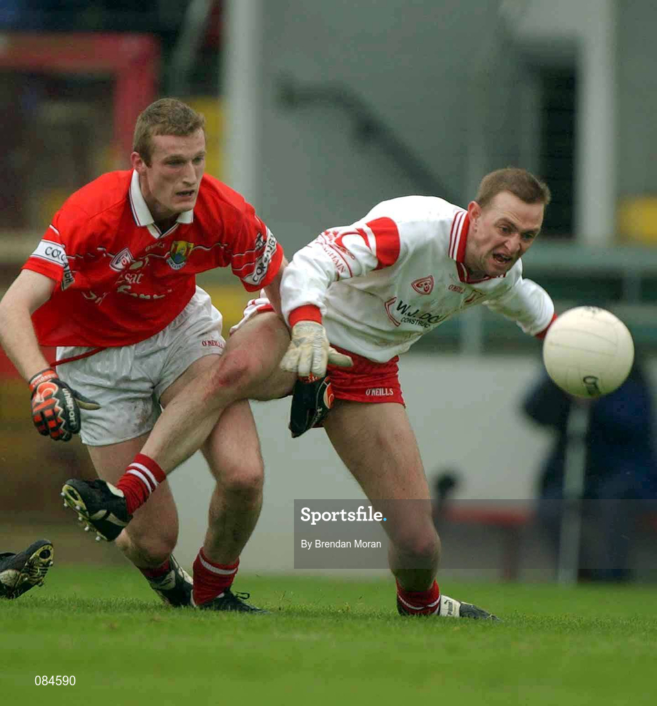31 March 2002; Gerard Cavlan of Tyrone in action against Nicholas Murphy of Cork during the Allianz Football League Division 1A Round 7 match between Cork and Tyrone at Páirc Uí Chaoimh in Cork. Photo by Brendan Moran/Sportsfile