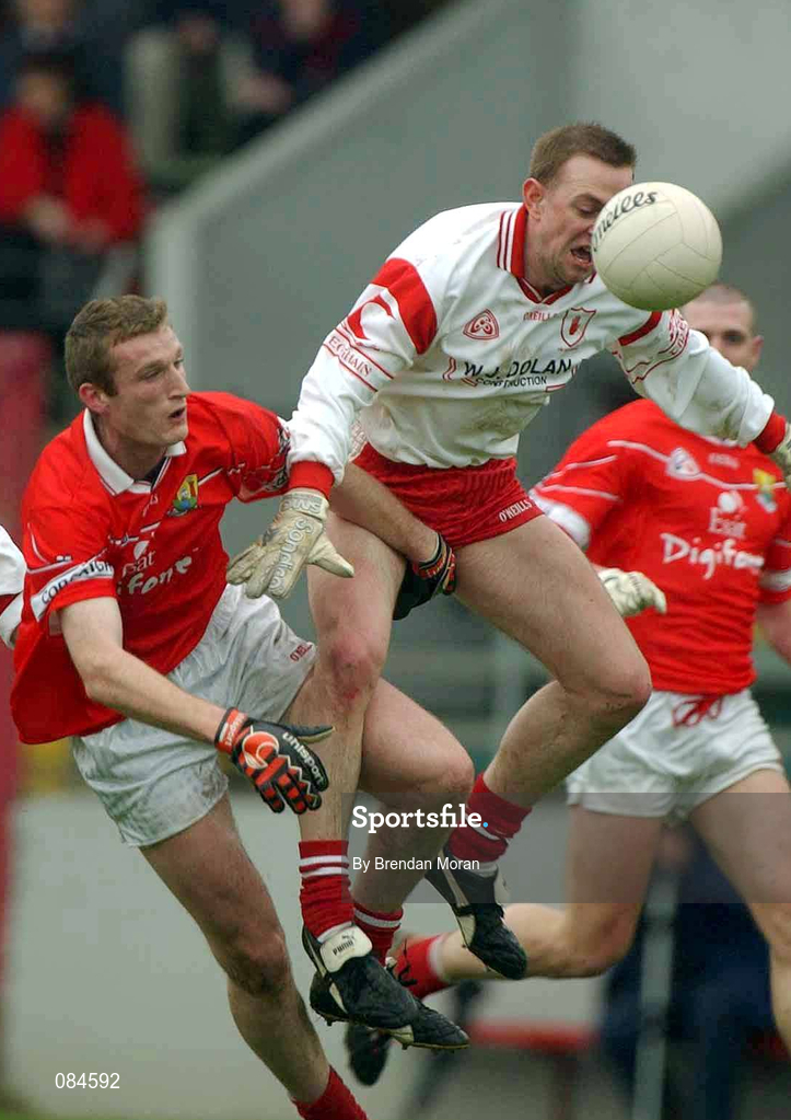 31 March 2002; Gerard Cavlan of Tyrone in action against Nicholas Murphy of Cork during the Allianz Football League Division 1A Round 7 match between Cork and Tyrone at Páirc Uí Chaoimh in Cork. Photo by Brendan Moran/Sportsfile