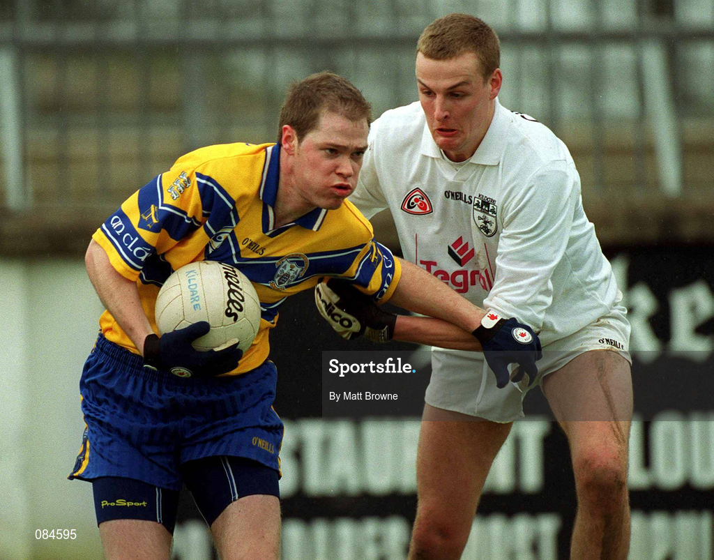 31 March 2002; Michael O'Shea of Clare is tackled by Padraig Mullarkey of Kildare during the Allianz National Football League Division 1B Round 7 match between Kildare and Clare at St Conleth's Park in Newbridge, Kildare. Photo by Matt Browne/Sportsfile