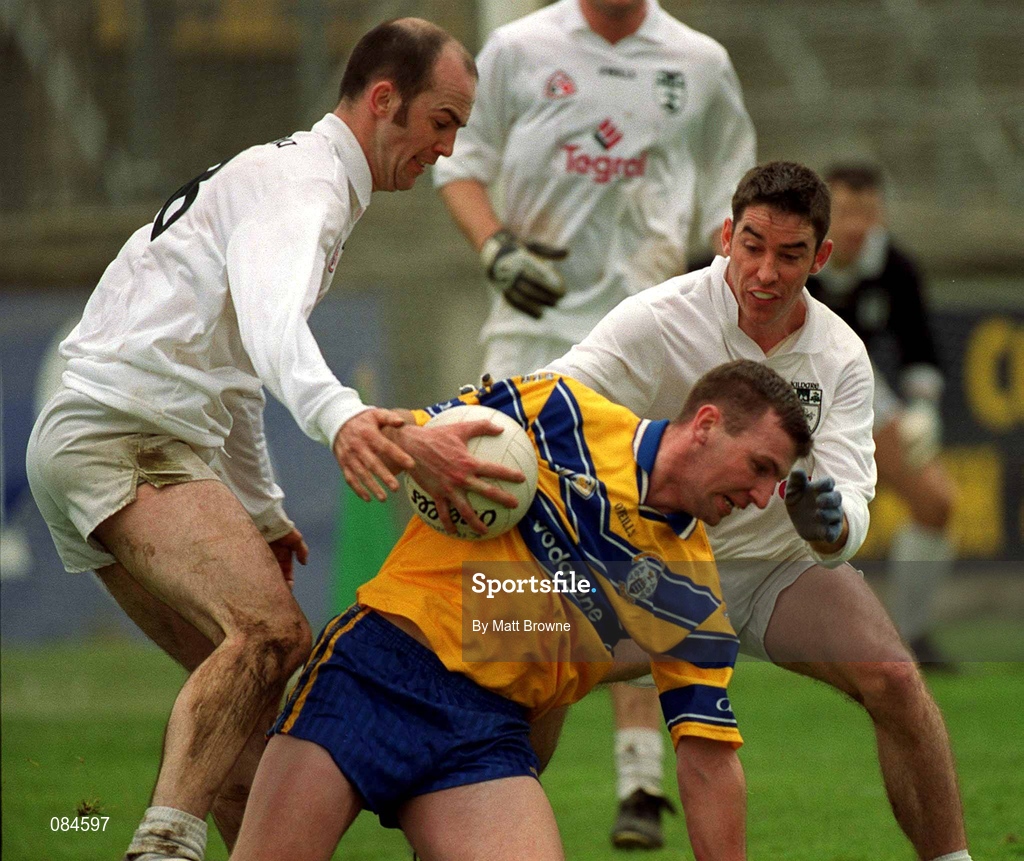 31 March 2002; Brian Considine of Clare is tackled by Killian Brennan, left, and Anthony Rainbow of Kildare during the Allianz National Football League Division 1B Round 7 match between Kildare and Clare at St Conleth's Park in Newbridge, Kildare. Photo by Matt Browne/Sportsfile