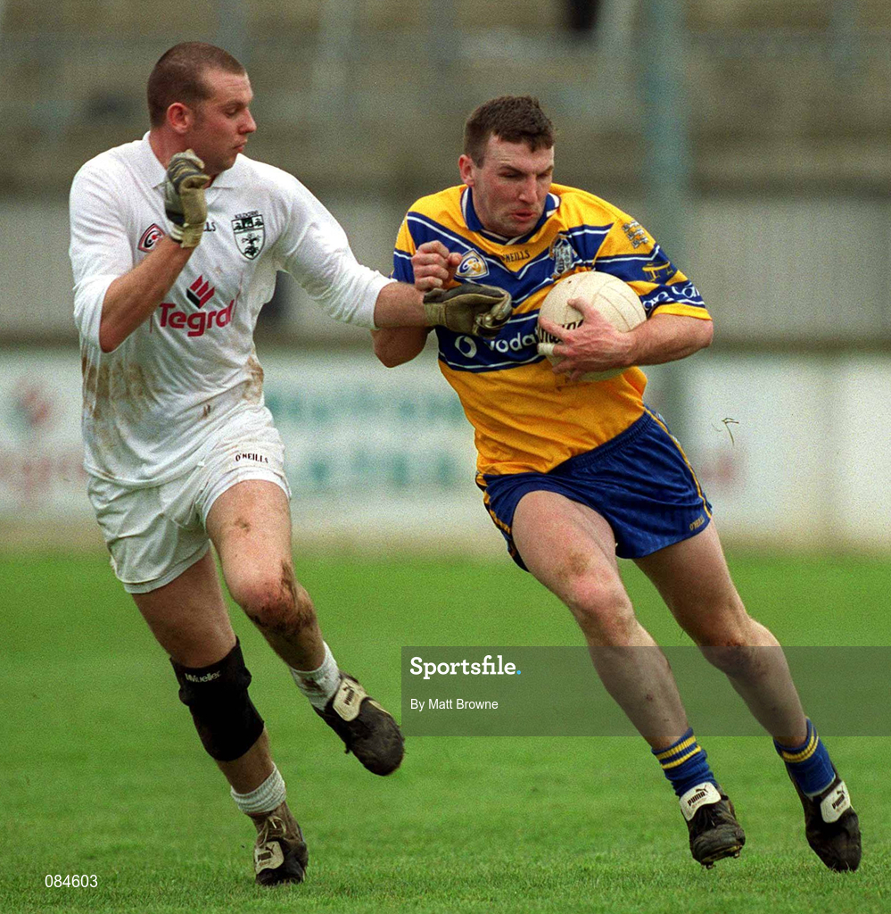 31 March 2002; Brian Considine of Clare is tackled by Ronan Sweeney of Kildare during the Allianz National Football League Division 1B Round 7 match between Kildare and Clare at St Conleth's Park in Newbridge, Kildare. Photo by Matt Browne/Sportsfile