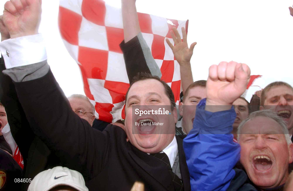 31 March 2002; St Patrick's Athletic manager Pat Dolan celebrates with fans on the pitch after the eircom League Premier Division match between Longford Town and St Patrtick's Athletic at Flancare Park in Longford. St Patrick's Athletic were top of the table after the last game of the season, only to later finish in third due to a 15 point deduction as Charles Mbabazi Livingstone was deemed to have played in five games while unregistered. Photo by David Maher/Sportsfile