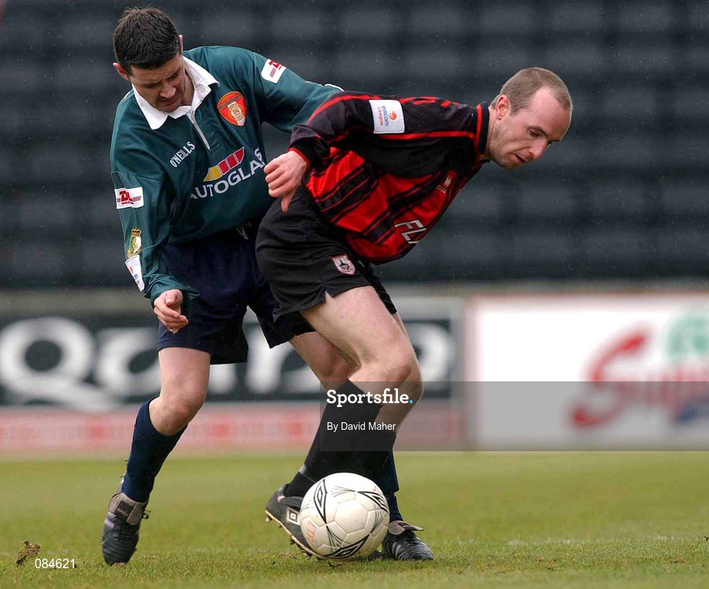 31 March 2002; Willie Burke of St Patrick's Athletic in action against Alan Kirby of Longford Town during the eircom League Premier Division match between Longford Town and St Patrtick's Athletic at Flancare Park in Longford. Photo by David Maher/Sportsfile