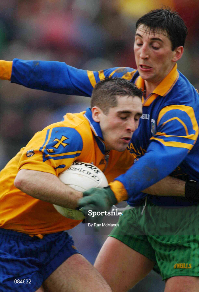 31 March 2002; John Hanley of Roscommon in action against Stephen Lohan of Donegal during the Allianz Football League Division 1A Round 7 match between Roscommon and Donegal at Dr Hyde Park in Roscommon. Please note Donegal wore the Roscommon  away strip due to a clash of jerseys. Photo by Ray McManus/Sportsfile