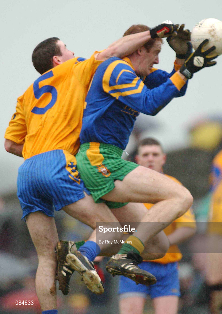 31 March 2002; Kevin Cassidy of Donegal in action against Martin Raftery of Roscommon during the Allianz Football League Division 1A Round 7 match between Roscommon and Donegal at Dr Hyde Park in Roscommon. Please note Donegal wore the Roscommon  away strip due to a clash of jerseys. Photo by Ray McManus/Sportsfile