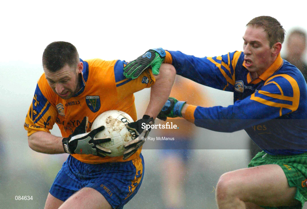 31 March 2002; Nigel Dineen of Roscommon in action against Ian Daly of Donegal during the Allianz Football League Division 1A Round 7 match between Roscommon and Donegal at Dr Hyde Park in Roscommon. Please note Donegal wore the Roscommon  away strip due to a clash of jerseys. Photo by Ray McManus/Sportsfile