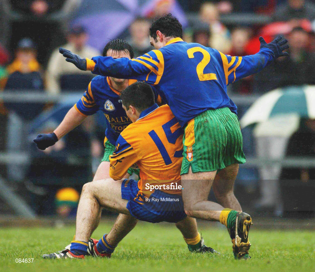 31 March 2002; John Hanley of Roscommon in action against Damien Diver, 2, and Mark Crossan of Donegal during the Allianz Football League Division 1A Round 7 match between Roscommon and Donegal at Dr Hyde Park in Roscommon. Please note Donegal wore the Roscommon  away strip due to a clash of jerseys. Photo by Ray McManus/Sportsfile