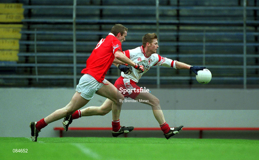 31 March 2002; Brian Dooher, Tyrone, in action against Nicholas Murphy, Cork. Cork v Tyrone, Allianz National Football League, Pairc Ui Chaoimh, Co. Cork. Picture credit; Brendan Moran / SPORTSFILE