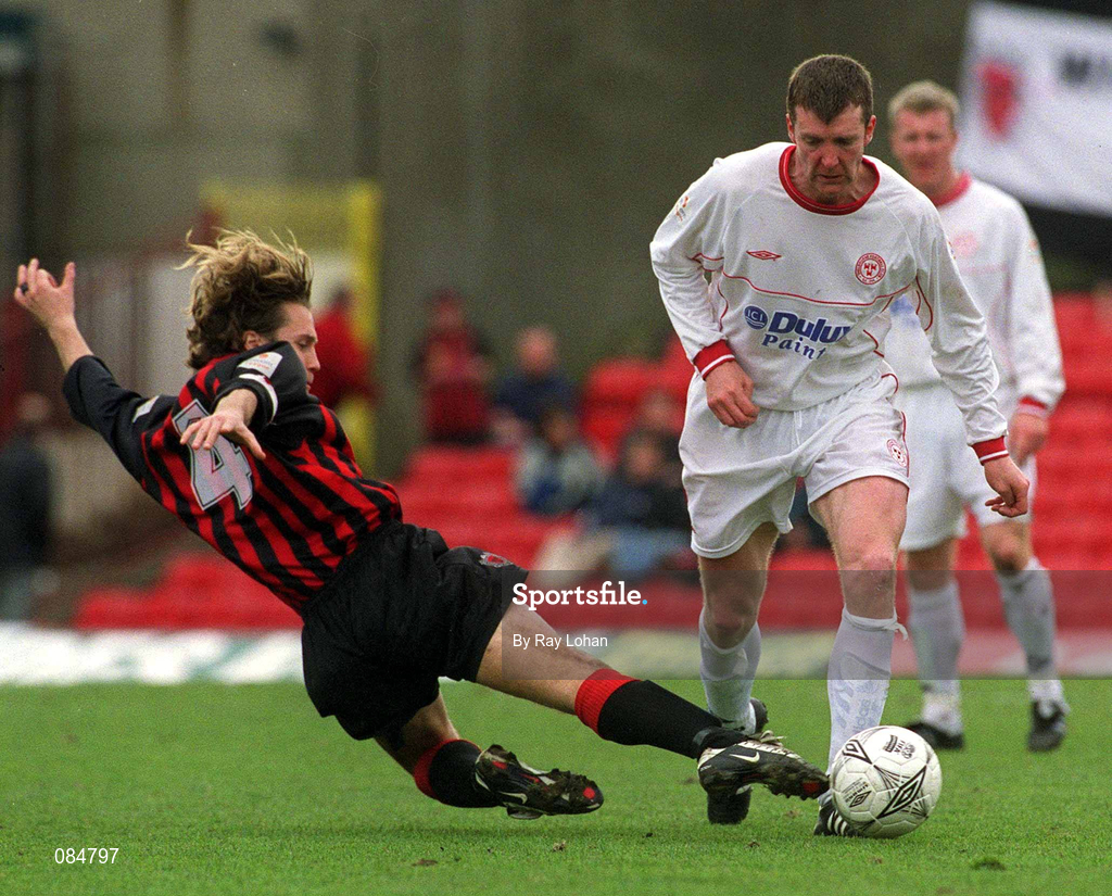 31 March 2002; Jim Gannnon of Shelbourne in action against Kevin Hunt of Bohemians during the eircom League Premier Division match between Bohemians and Shelbourne at Dalymount Park in Dublin. Photo by Ray Lohan/Sportsfile