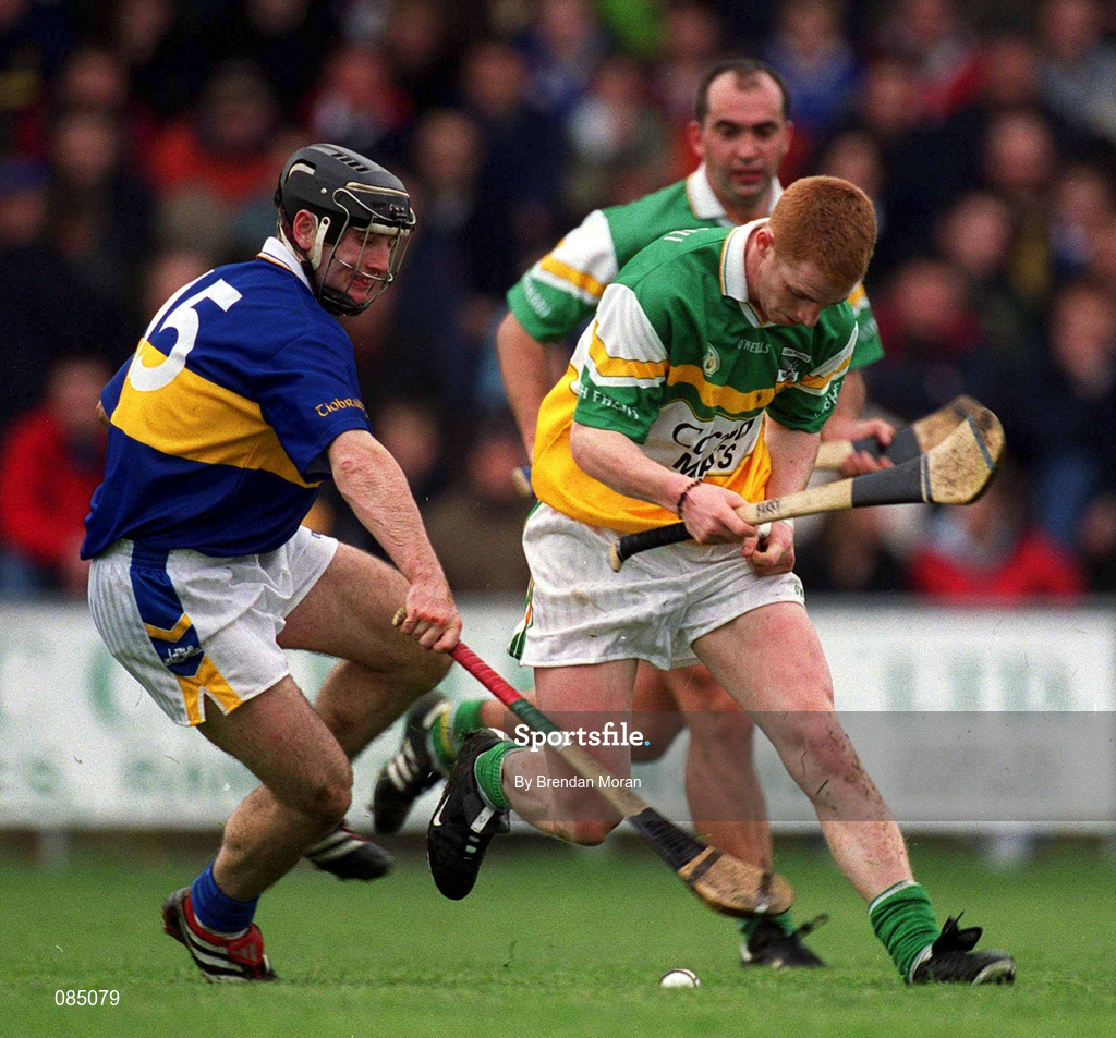 30 March 2002; Barry Whelahan of Offaly in action against Eoin Kelly of Tipperary during the Allianz National Hurling League Division 1B Round 1 match between Offaly and Tipperary in St Brendan's Park in Birr, Offaly. Photo by Brendan Moran/Sportsfile