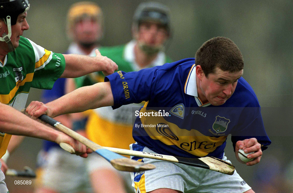 30 March 2002; John Carroll of Tipperary in action against Hubert Rigney of Offaly during the Allianz National Hurling League Division 1B Round 1 match between Offaly and Tipperary in St Brendan's Park in Birr, Offaly. Photo by Brendan Moran/Sportsfile