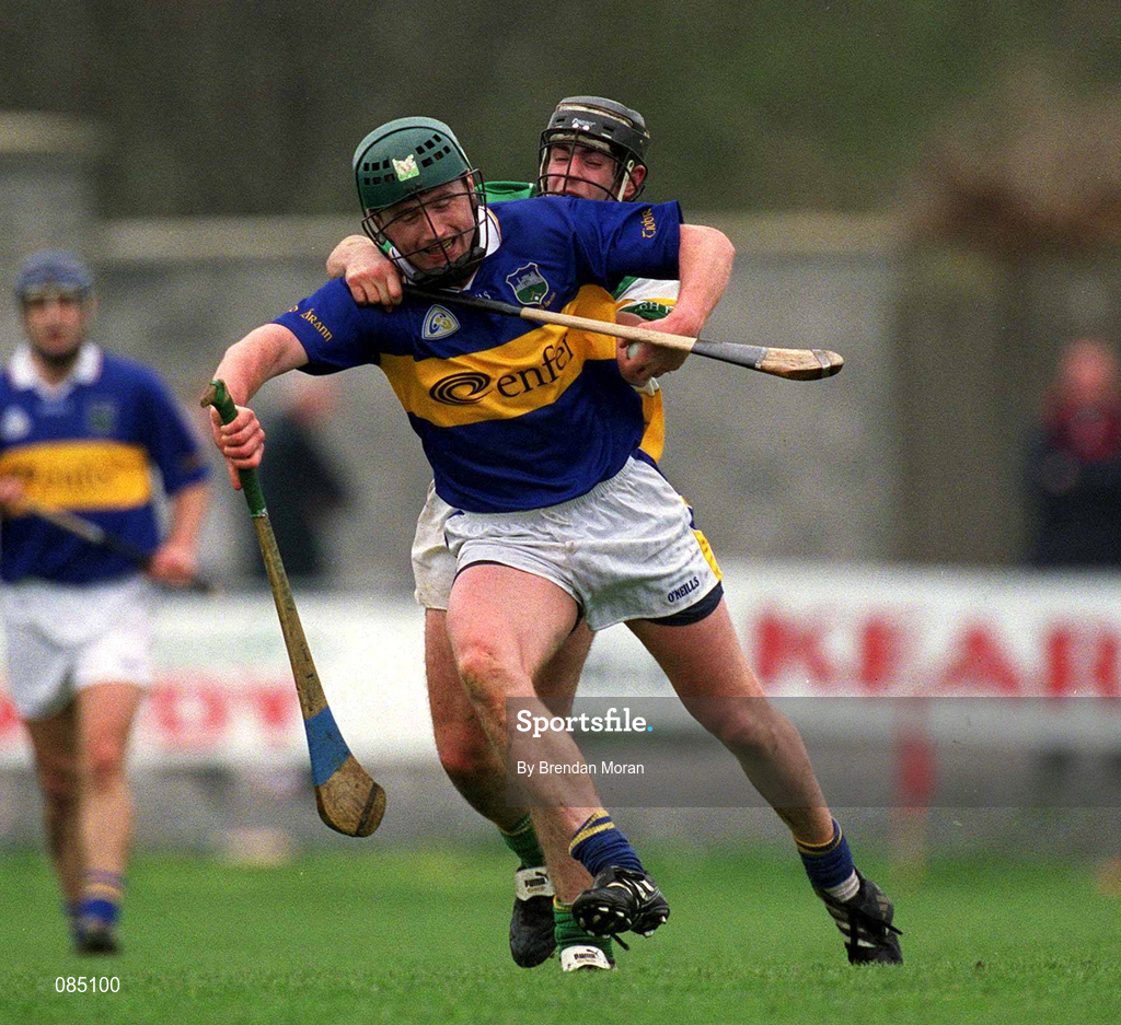 30 March 2002; David Kennedy of Tipperary in action against Brendan Murphy of Offaly during the Allianz National Hurling League Division 1B Round 1 match between Offaly and Tipperary in St Brendan's Park in Birr, Offaly. Photo by Brendan Moran/Sportsfile