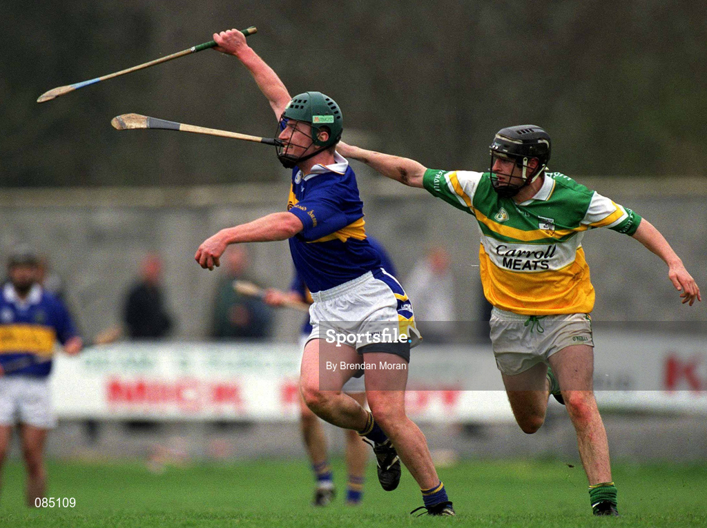 30 March 2002; David Kennedy of Tipperary in action against Brendan Murphy of Offaly during the Allianz National Hurling League Division 1B Round 1 match between Offaly and Tipperary in St Brendan's Park in Birr, Offaly. Photo by Brendan Moran/Sportsfile