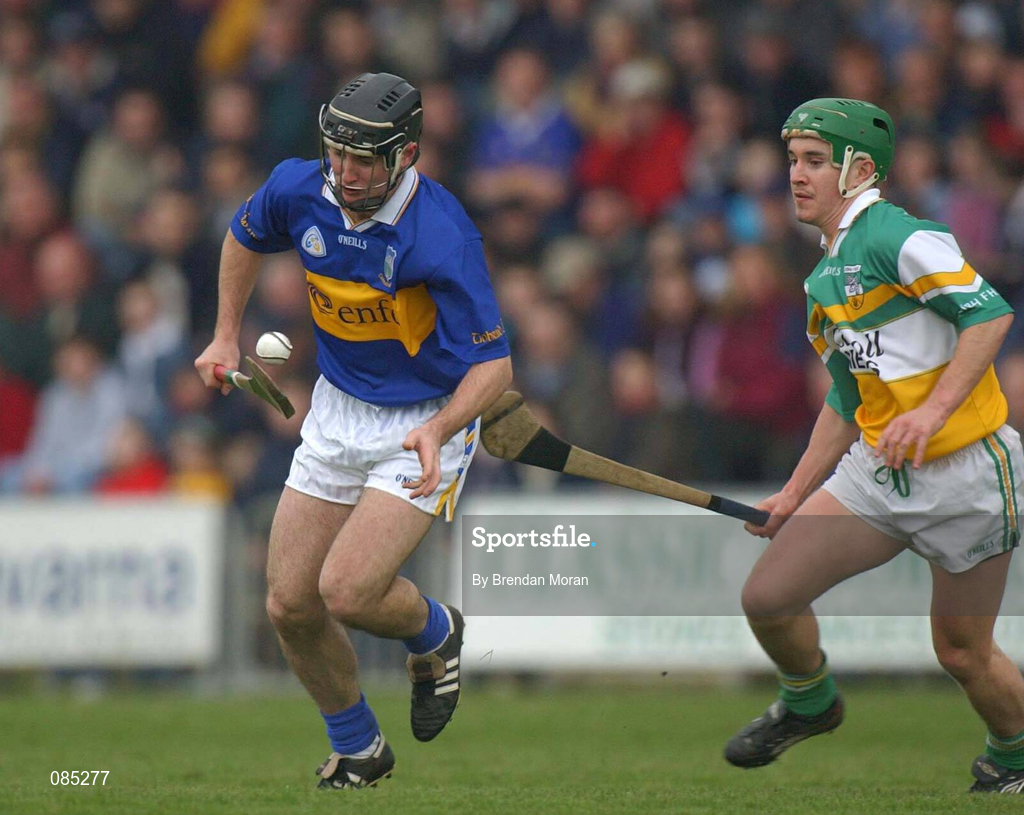30 March 2002; Eoin Kelly of Tipperary in action against David Franks of Offaly during the Allianz National Hurling League Division 1B Round 1 match between Offaly and Tipperary in St Brendan's Park in Birr, Offaly. Photo by Brendan Moran/Sportsfile
