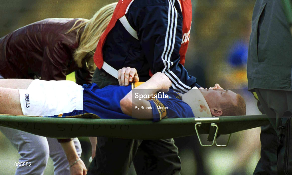 14 April 2002; Eamonn Corcoran of Tipperary leaves the field on a stretcher with a neck brace after receiving an injury during the Allianz National Hurling League Quarter-Final match between Galway and Tipperary at Semple Stadium in Thurles, Tipperary. Photo by Brendan Moran/Sportsfile