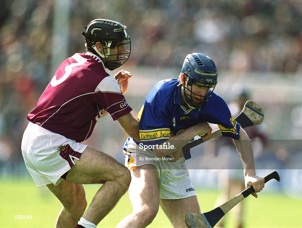 14 April 2002; John O'Brien of Tipperary in action against Michael Healy of Galway during the Allianz National Hurling League Quarter-Final match between Galway and Tipperary at Semple Stadium in Thurles, Tipperary. Photo by Brendan Moran/Sportsfile